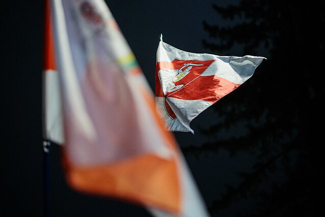 People wait for prisoners released from Belarus to arrive in Vilnius.