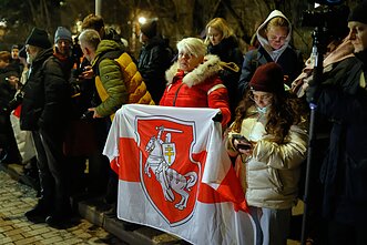 A crowd waiting released Belarusian prisoners at the US Embassy in Vilnius last Saturday A crowd waiting released Belarusian prisoners at the US Embassy in Vilnius last Saturday