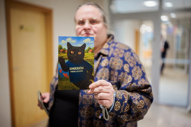 MP Agnė Širinskienė with a picture of her cat, Nuodėgulis
