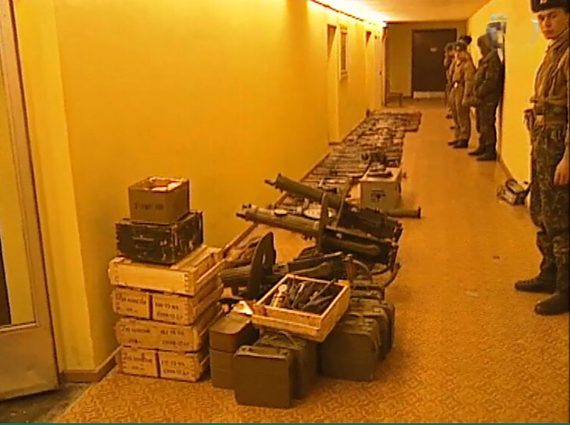 Replicas shown as seized weapons.