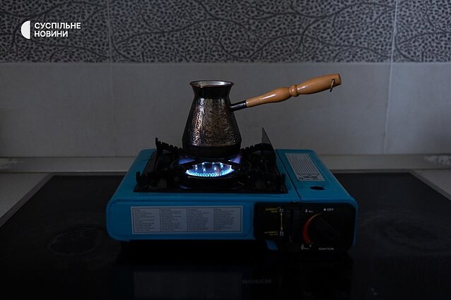 The portable gas burner allows the family to heat food and water for drinks during a power outage.