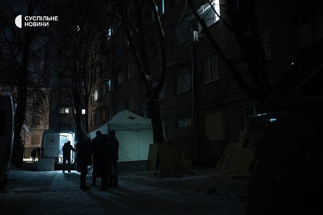 Volunteer tents near a high-rise building in the Solomyanskyi district of Kyiv, which was damaged by debris from a Russian drone on the night of January 12.