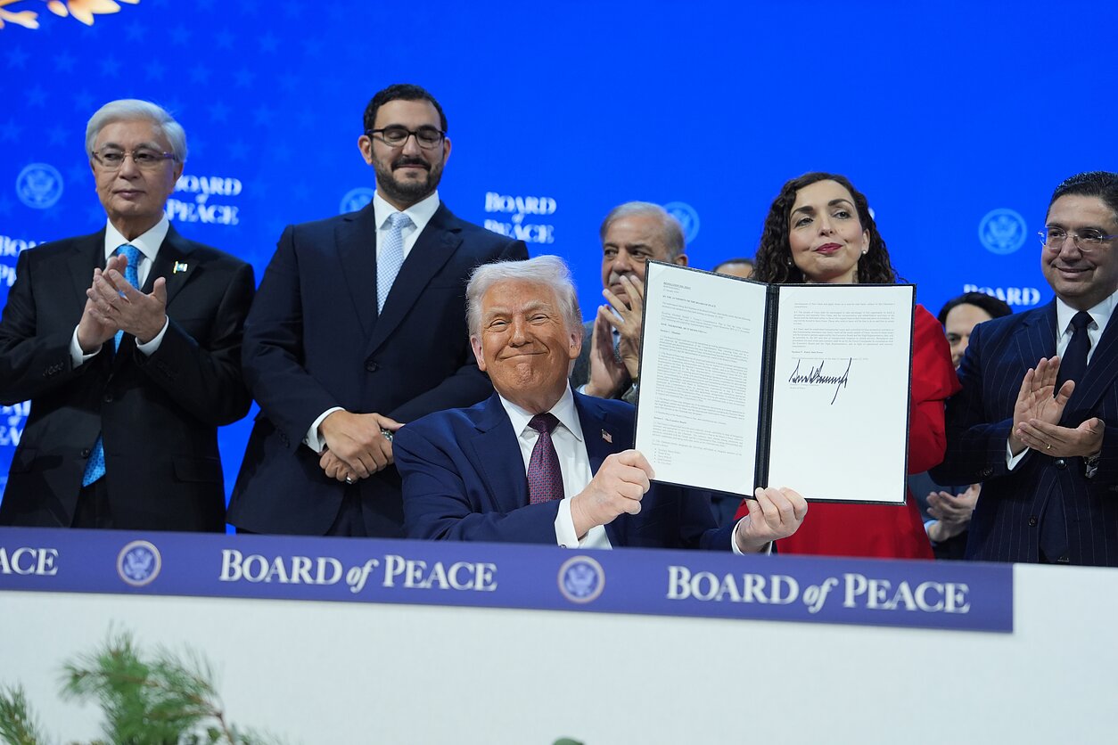 Donald Trump signing the charter of his so-called Board of Peace