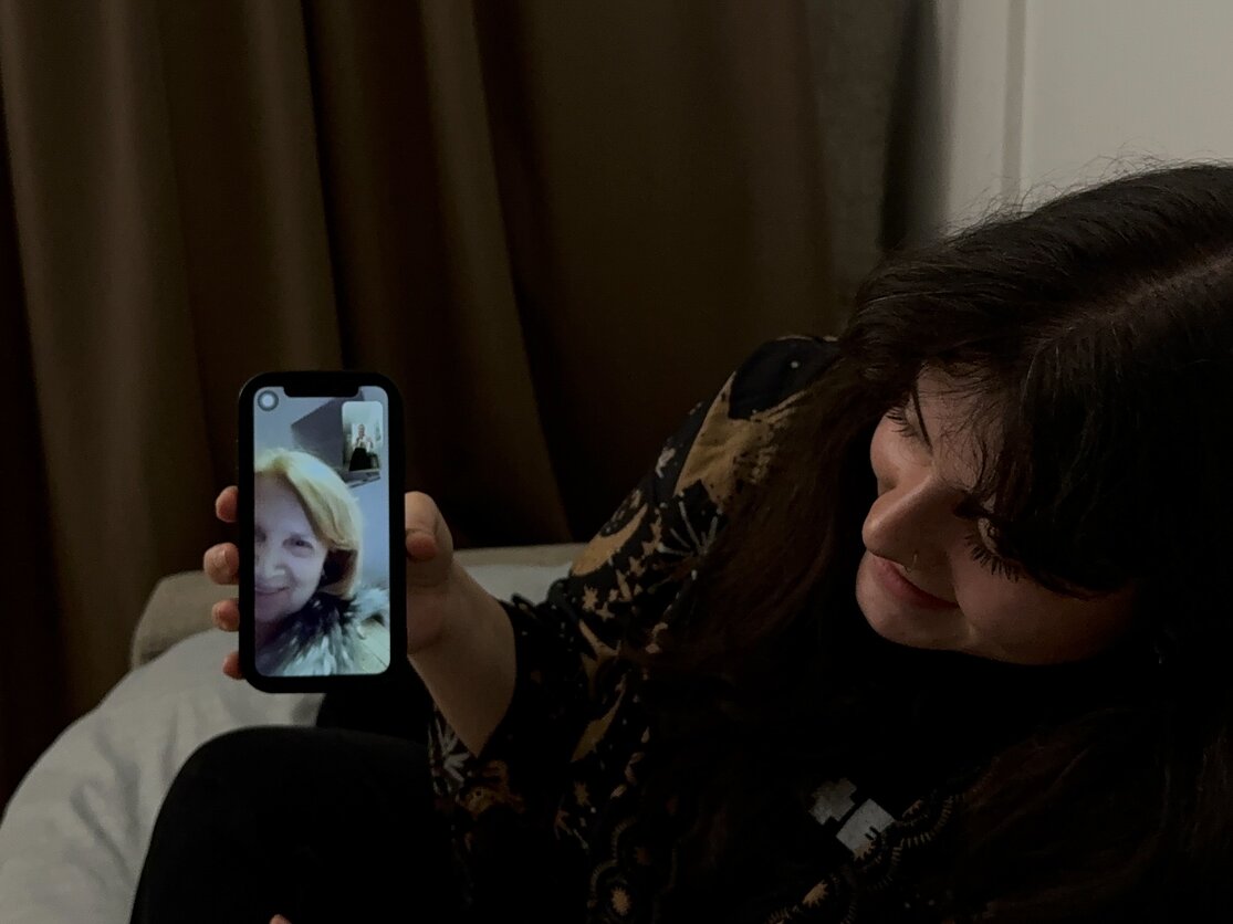 Evening call with her grandmother, who desired to share the collection of her flower paintings through FaceTime. Evening call with her grandmother, who desired to share the collection of her flower paintings through FaceTime.