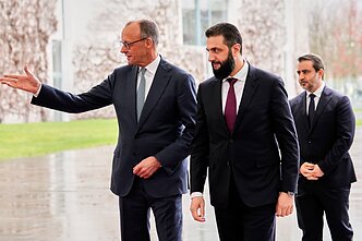 Friedrichas Merzas ir Ahmedas Al Sharaa