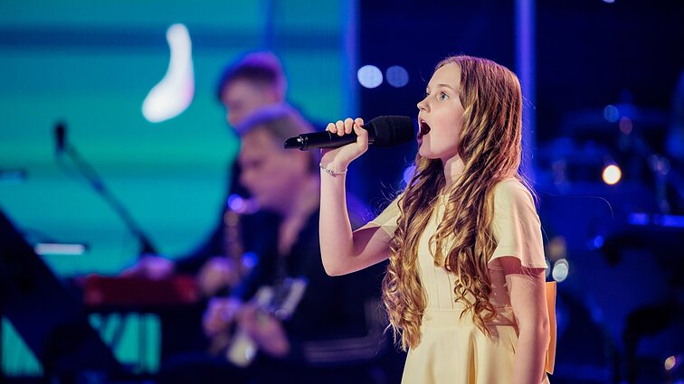 Dainų dainelė 2026. Auksė Gedvilaitė – „Uogos aukso / Ougas auksa“