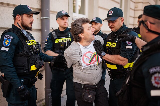 Man detained for throwing a smoke device at marchers Man detained for throwing a smoke device at marchers