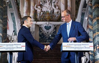 Emmanuelis Macronas ir Friedrichas Merzas